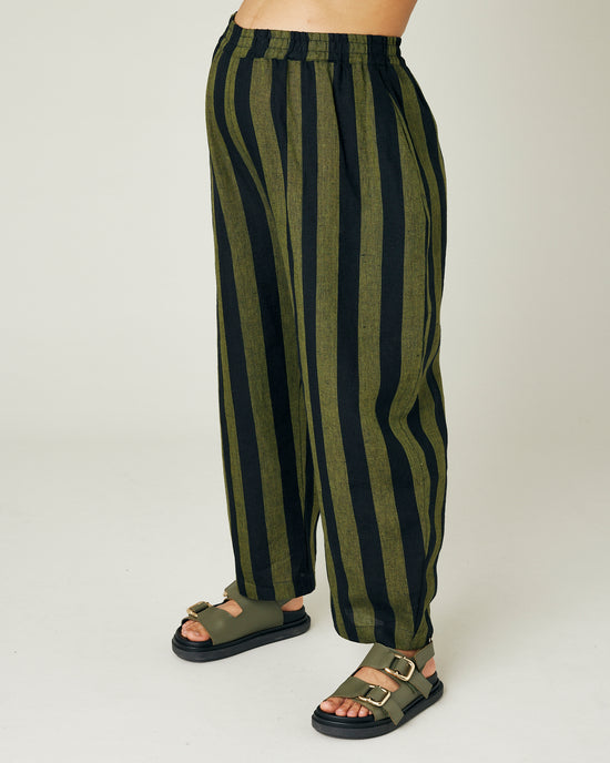 pregnant model wears olive and black stripe linen mabel trousers