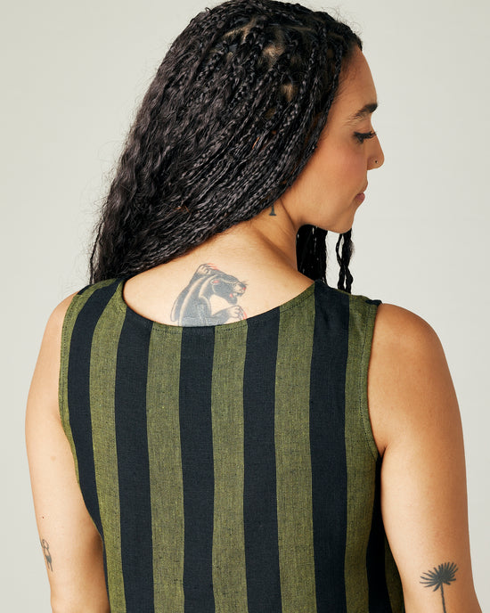 model wears olive and black stripe linen esme top