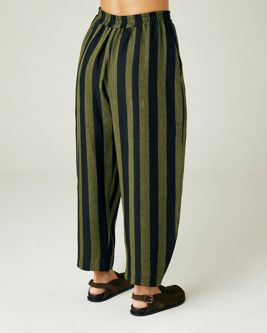 model wears olive and black stripe linen mabel trousers right