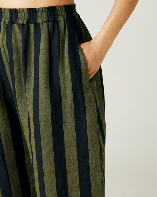 model wears olive and black stripe linen mabel trousers