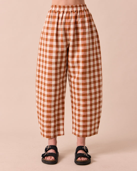 model wears mabel amber check linen trousers front