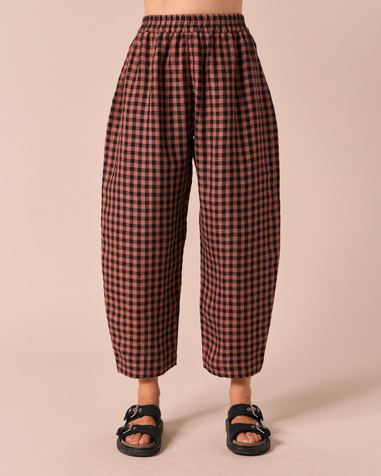 model wears mabel dried rose gingham linen trousers front
