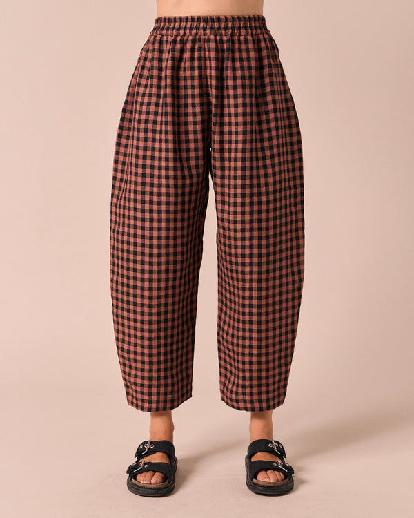 model wears mabel dried rose gingham linen trousers front