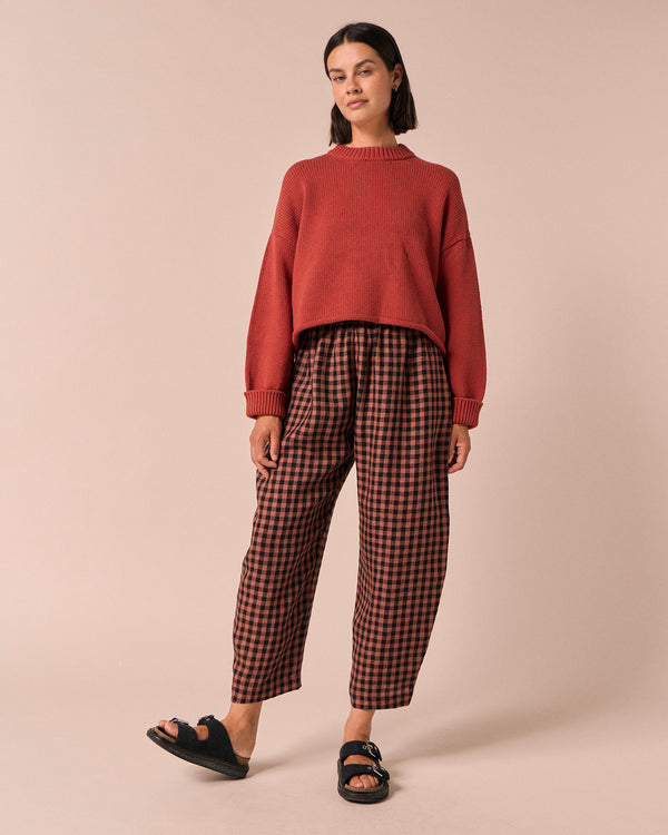 model wears mabel dried rose gingham linen trousers right