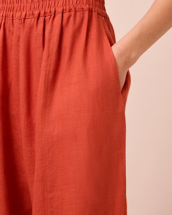 model wears mabel burnt orange linen trousers