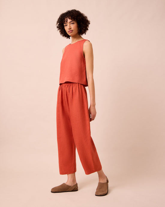 model wears mabel burnt orange linen trousers right