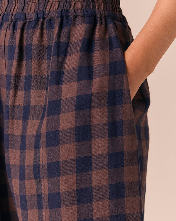model wears mabel cedar check linen trousers 