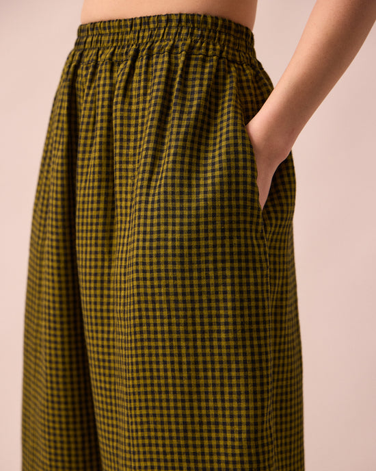model wears mabel fresh olive mini gingham linen trousers detail