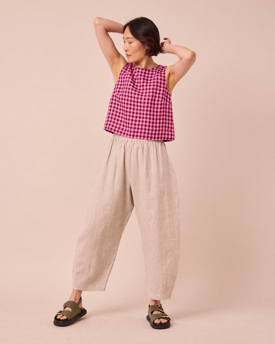 model wears mabel natural linen trousers right
