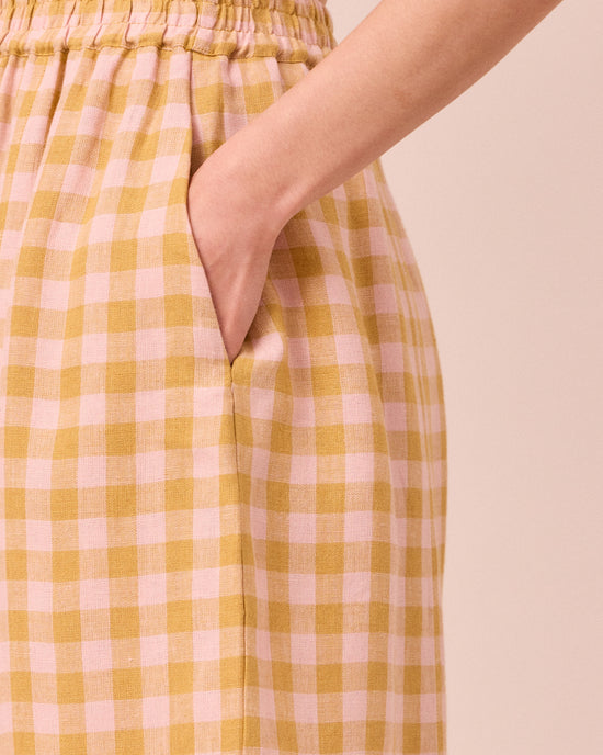 model wears mabel ochre gingham linen trousers 