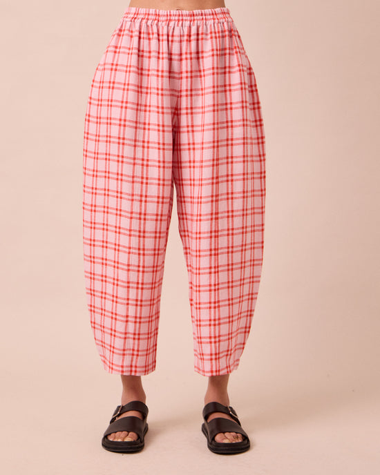 model wears mabel rosa plaid linen trousers front