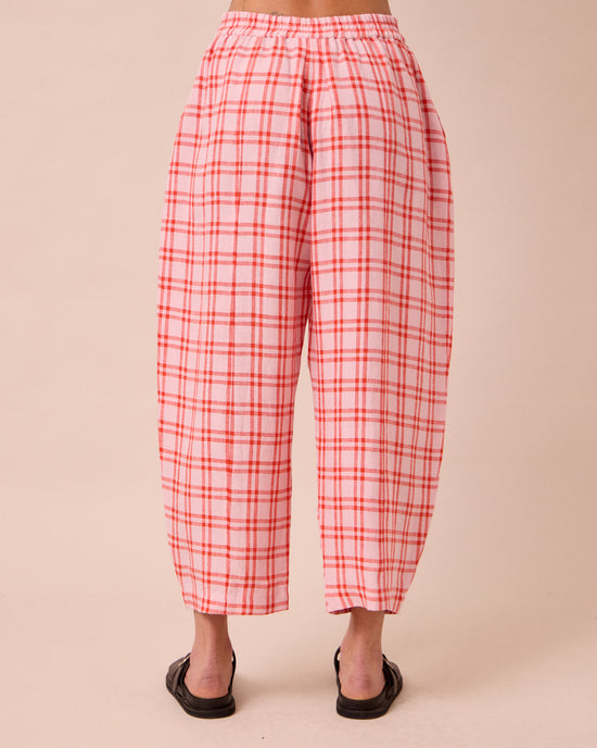 model wears mabel rosa plaid linen trousers back