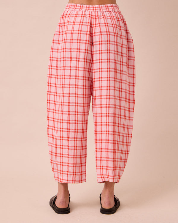 model wears mabel rosa plaid linen trousers back
