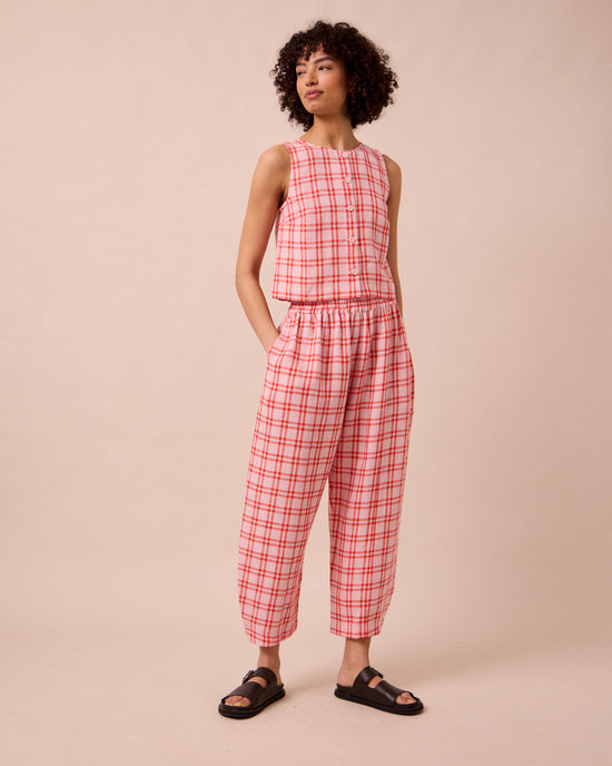 model wears mabel rosa plaid linen trousers right