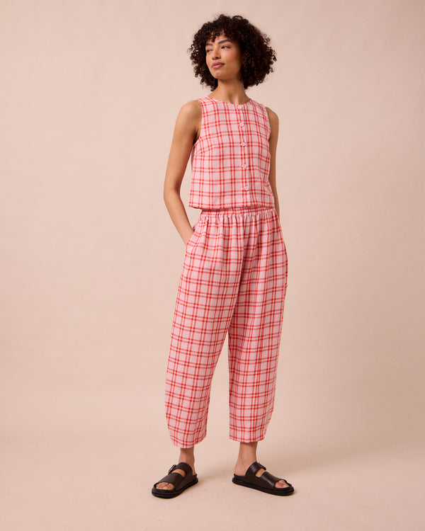 model wears mabel rosa plaid linen trousers right