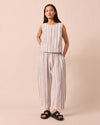 model wears mabel sailor stripe linen trousers left