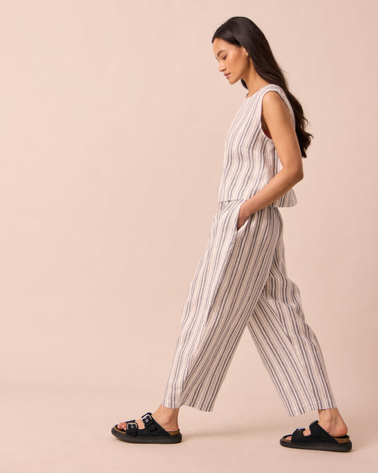 model wears mabel sailor stripe linen trousers right