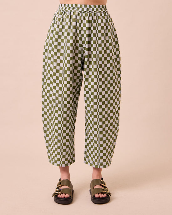 model wears mabel sky checkerboard linen trousers front