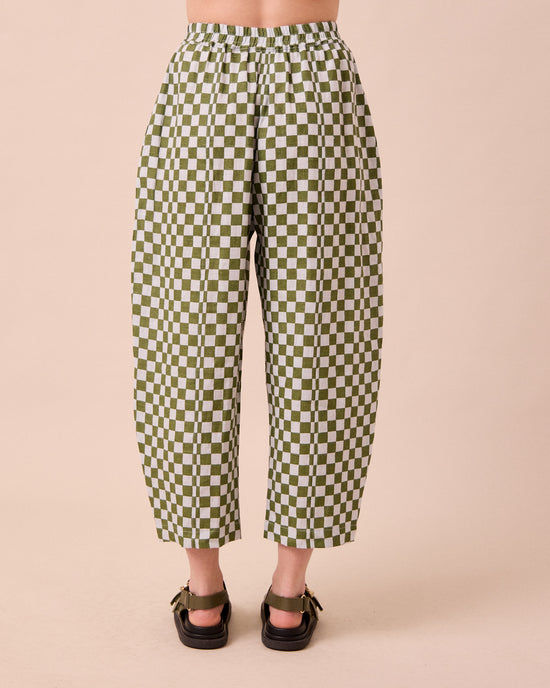 model wears mabel sky checkerboard linen trousers back