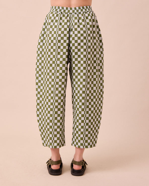 model wears mabel sky checkerboard linen trousers back