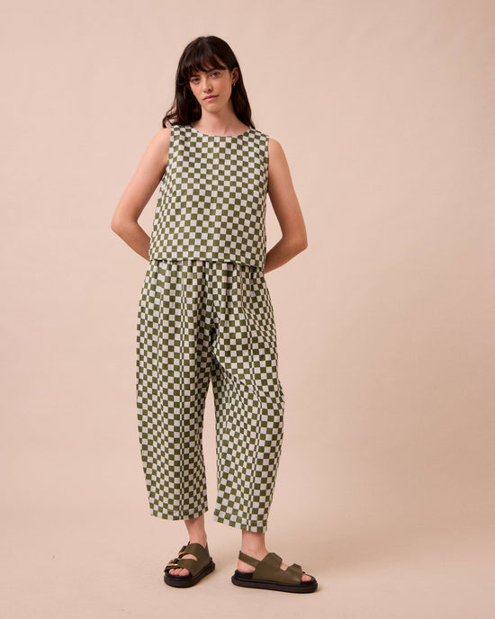 model wears mabel sky checkerboard linen trousers right