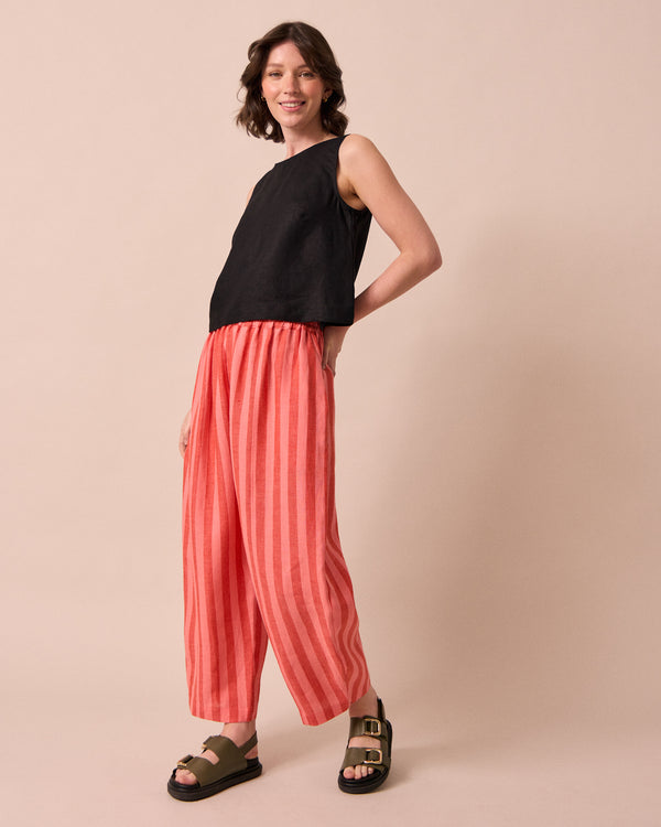 model wears sorbet stripe mabel linen trousers left