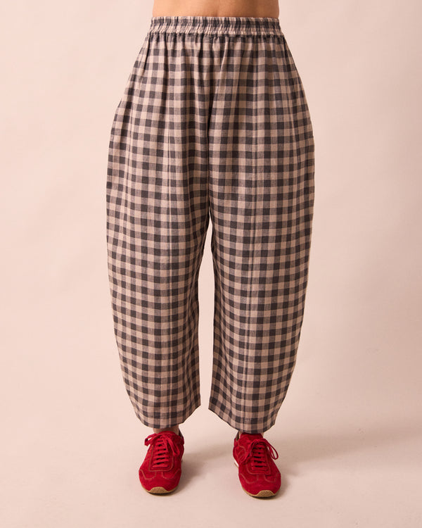 model wears mabel stone gingham linen trousers front