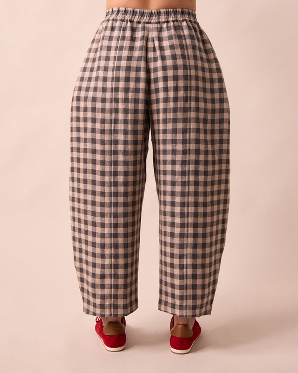 model wears mabel stone gingham linen trousers back