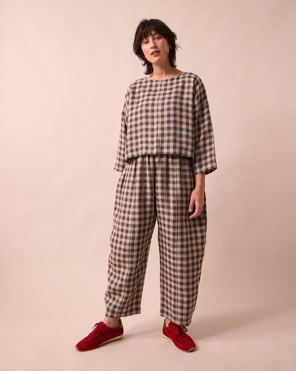 model wears mabel stone gingham linen trousers right