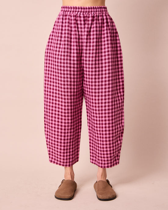 model wears mabel summer berry gingham linen trousers front