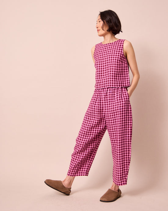 model wears mabel summer berry gingham linen trousers right
