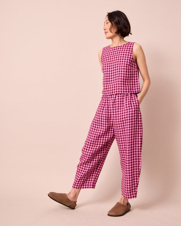 model wears mabel summer berry gingham linen trousers right