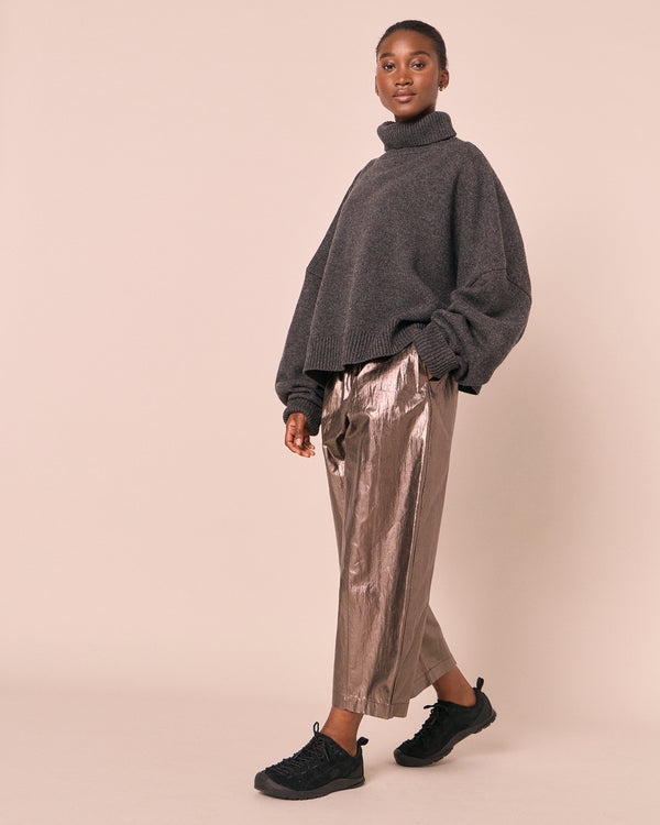 model wears mabel pewter metallic linen trousers right
