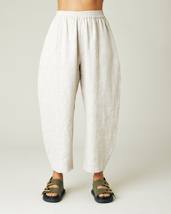 model wears natural linen mabel trousers from the front