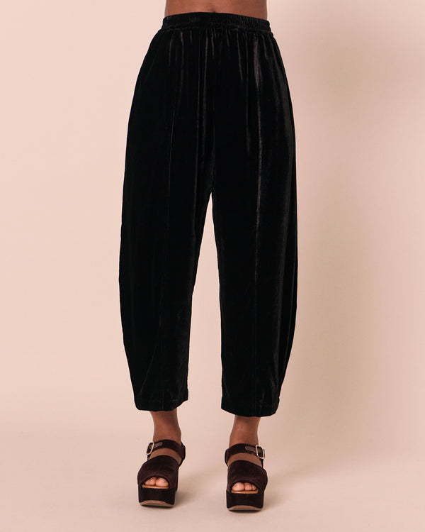 model wears mabel black velvet trousers front