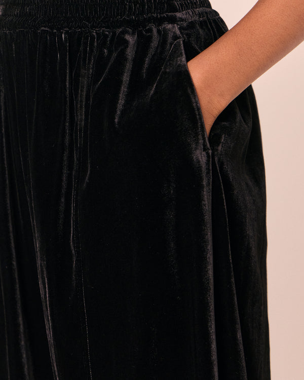 model wears mabel black velvet trousers