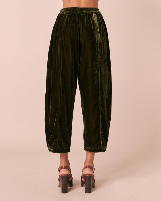model wears mabel moss velvet trousers back