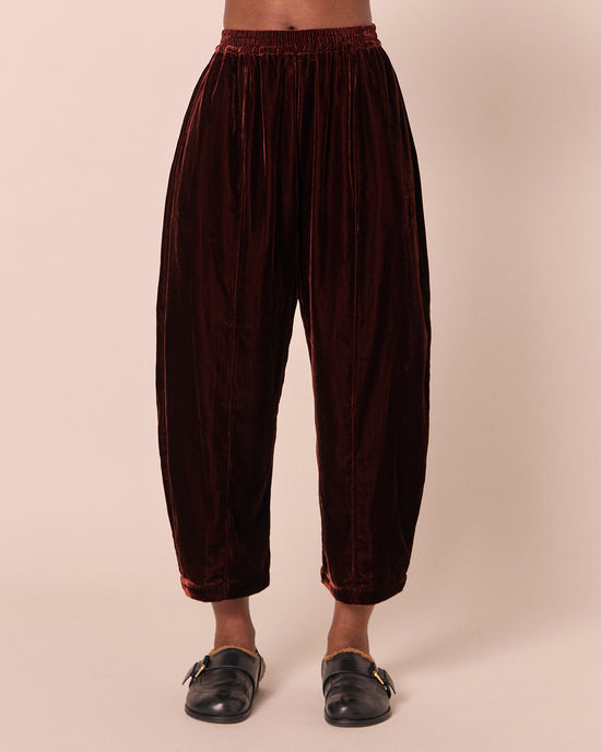 model wears mabel umber velvet trousers front
