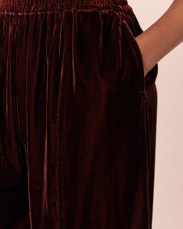 model wears mabel umber velvet trousers