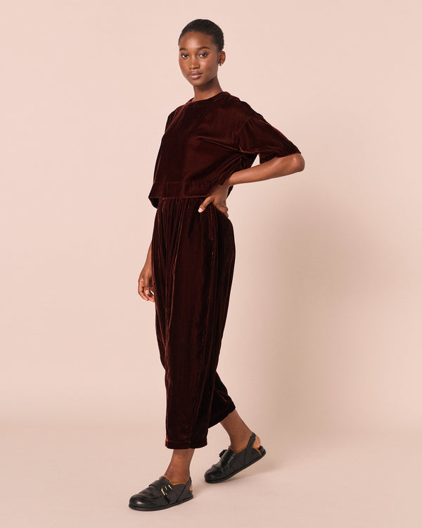 model wears mabel umber velvet trousers right