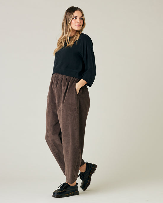 pregnant model wears brown cord mabel trousers