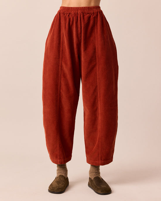 model wears mabel burnt orange cord trousers front
