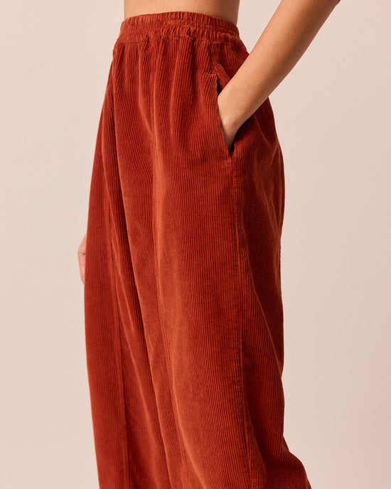 model wears mabel burnt orange cord trousers