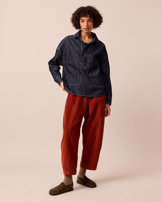 model wears mabel burnt orange cord trousers left