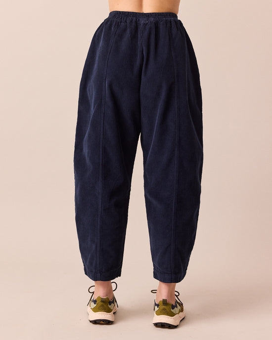 model wears mabel navy cord trousers back