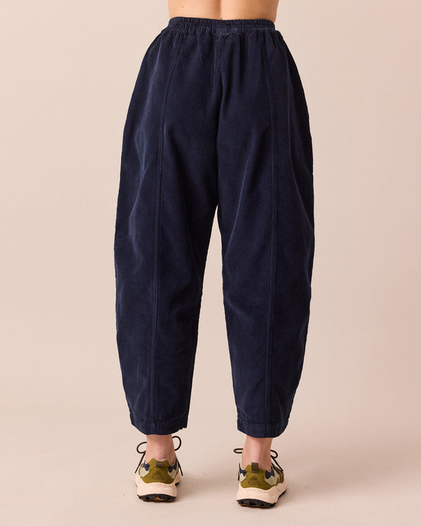 model wears mabel navy cord trousers back