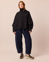 model wears mabel navy cord trousers right
