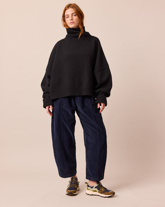 model wears mabel navy cord trousers right