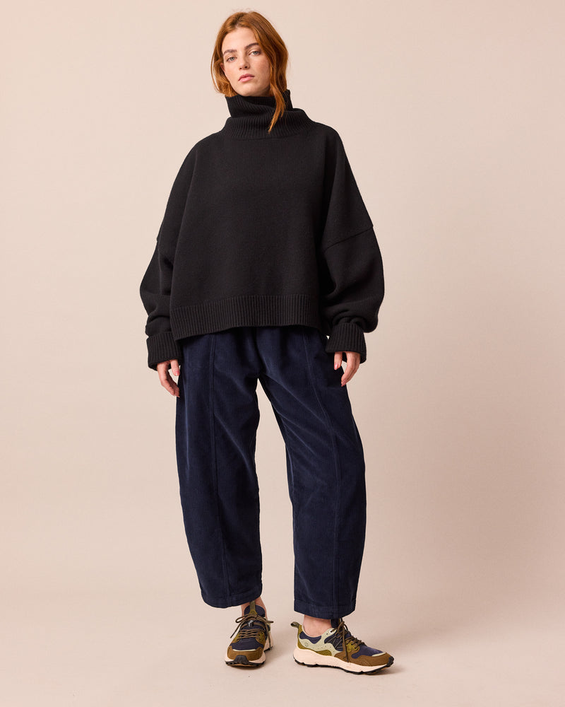 model wears mabel navy cord trousers right