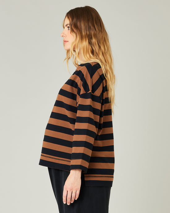 pregnant model wears rust stripe breton top